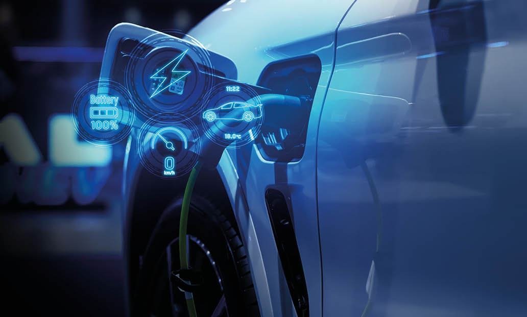 Power cable pump plug in charging power to electric vehicle EV car.