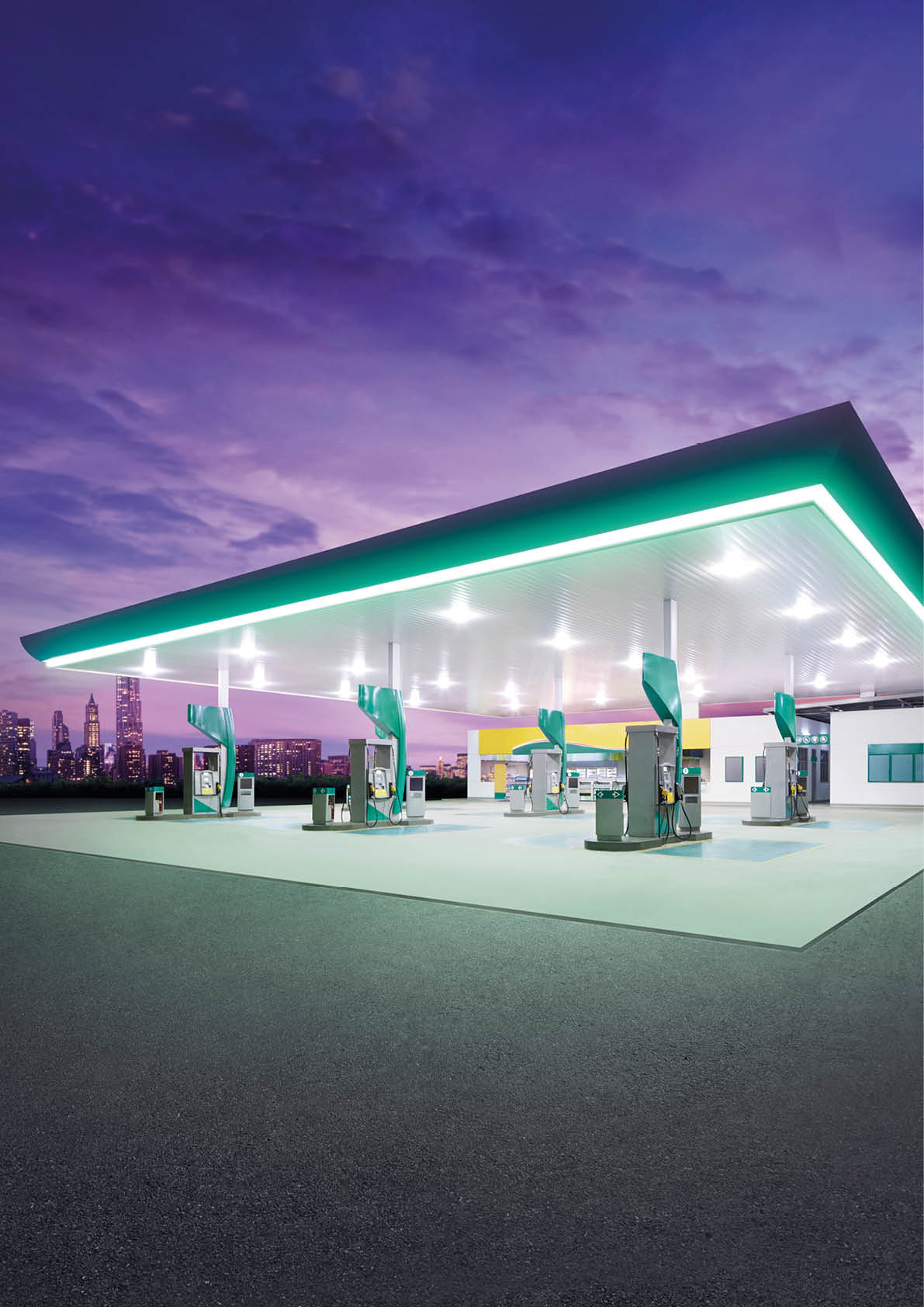 Petrol gas station at night with city building 