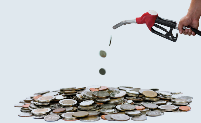 Concept saving Hand holding fuel nozzle pouring thai coin isolated in white background