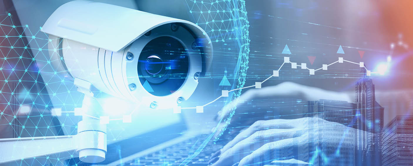 Hands of woman typing on laptop with double exposure of CCTV camera, planet interface and cityscape. Concept of surveillance and security. Toned image