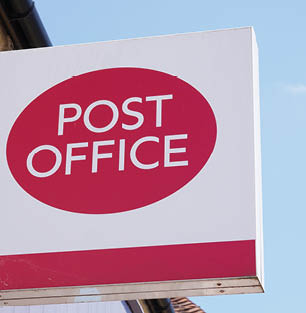 Botley, Hampshire England - 05.20.2024 - Post Office sign in Botley village. Postal services in the UK 