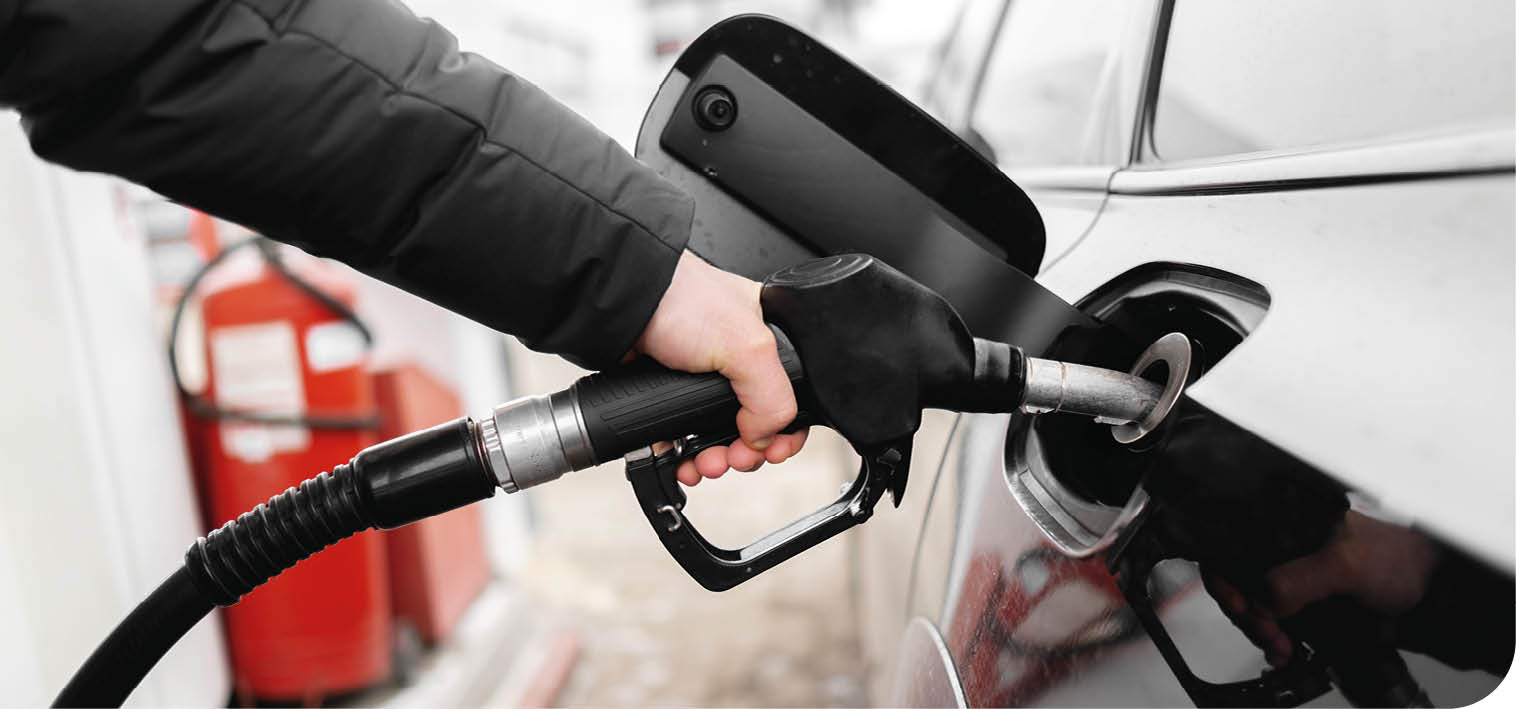 A person is filling up their car with gas. AI generated content