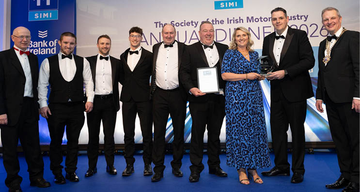 A group of men and women pose for a photo at an awards ceremony. AI generated content