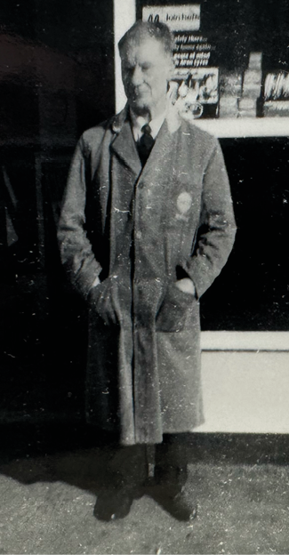 A man in a suit stands outside a store. AI generated content