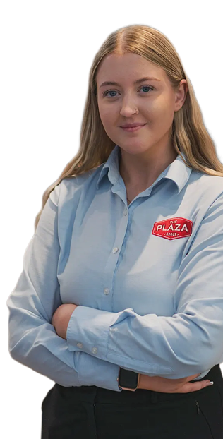 A woman in a blue shirt and black pants is standing with her arms crossed. AI generated content