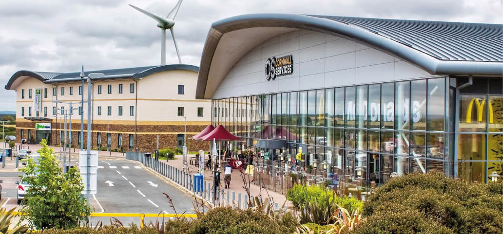 A large building with a windmill on top. The building is a McDonald's restaurant. AI generated content