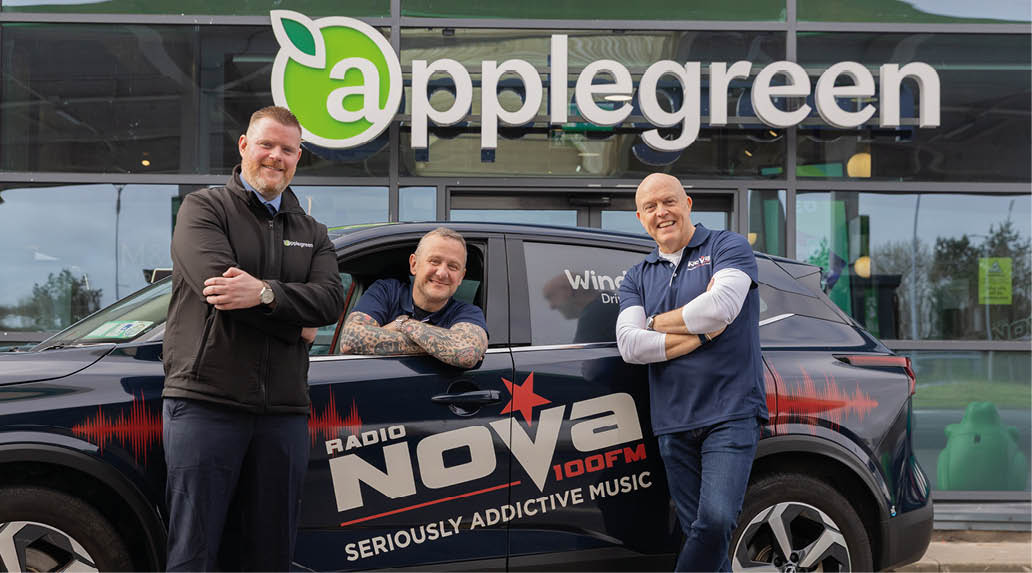 Three men are standing in front of a black car with a sign that says “Applegreen." They are posing for a picture. AI generated content