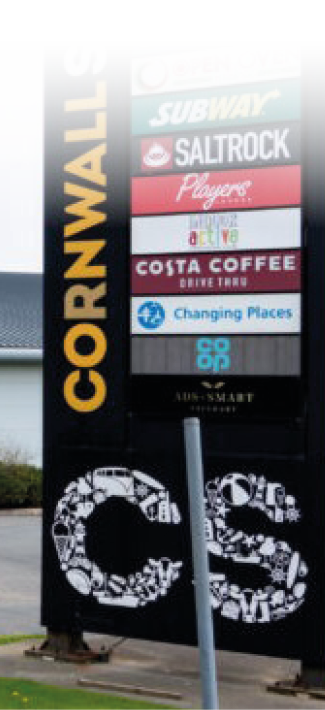 A large sign with the letters CS on it is in front of a building. AI generated content