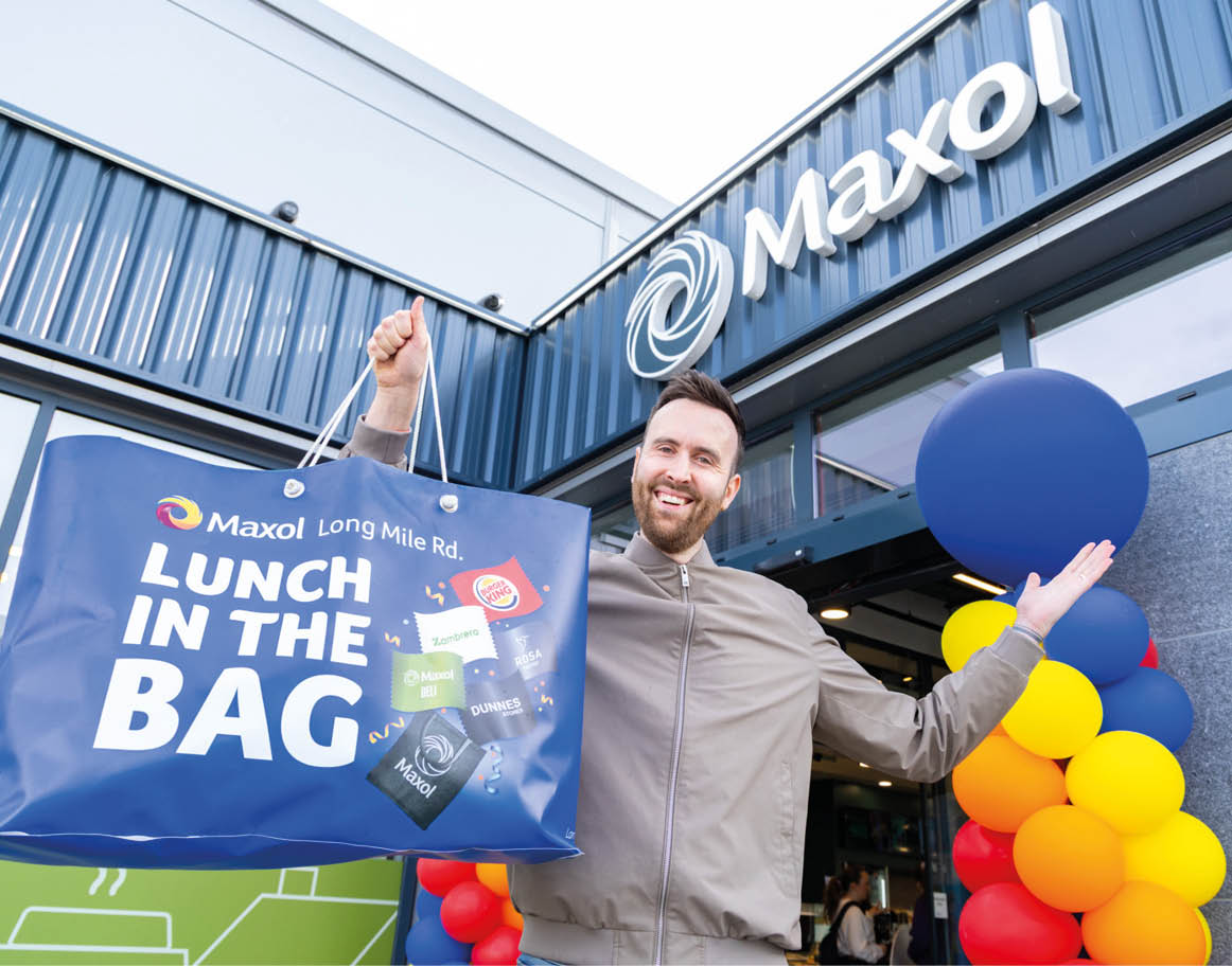 A man is holding a blue bag with a lunch in the bag. AI generated content