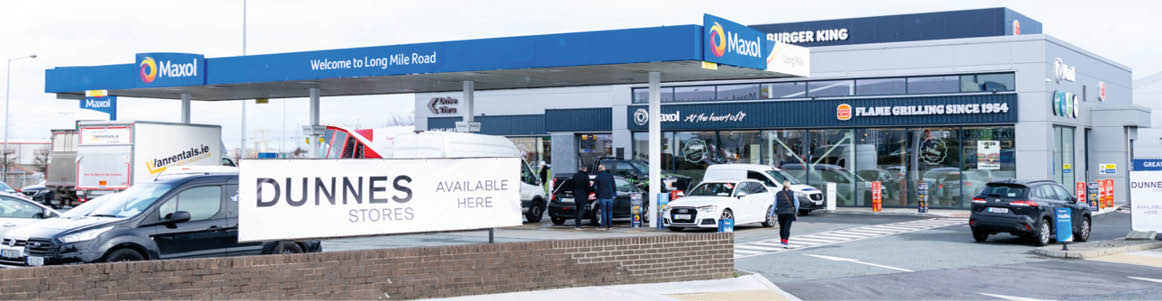 A gas station with a blue canopy. Description generated by AI