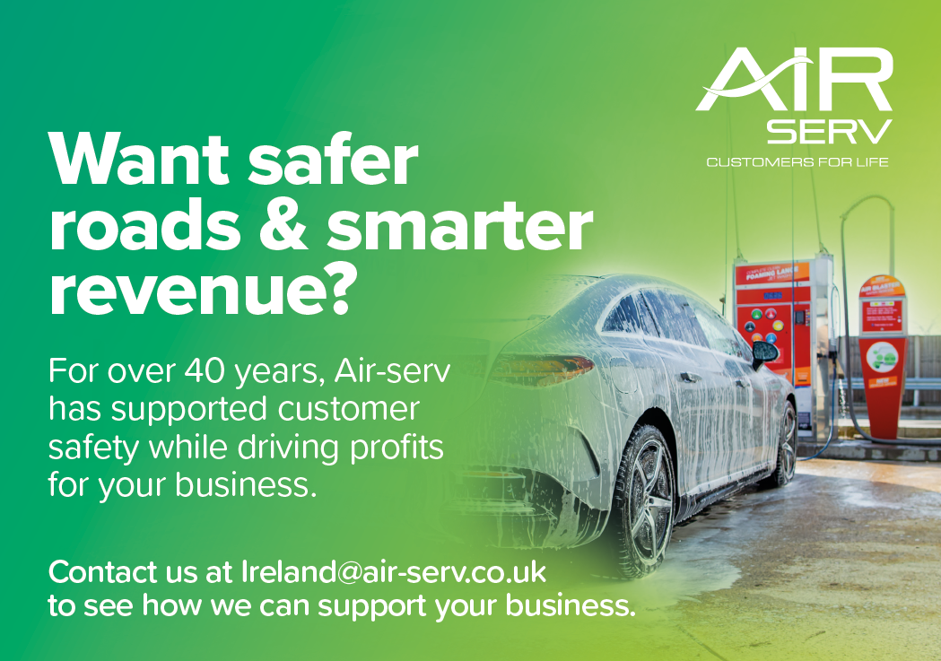 A car is being washed at a gas station. Description generated by AI