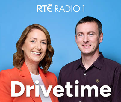 A man and a woman are smiling for a picture. Description generated by AI