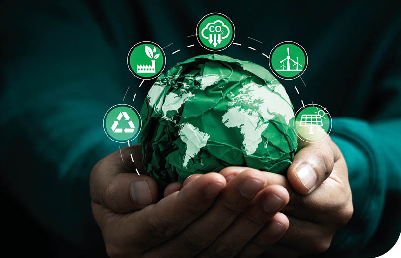 A person is holding a globe with green and white lights on it. Description generated by AI