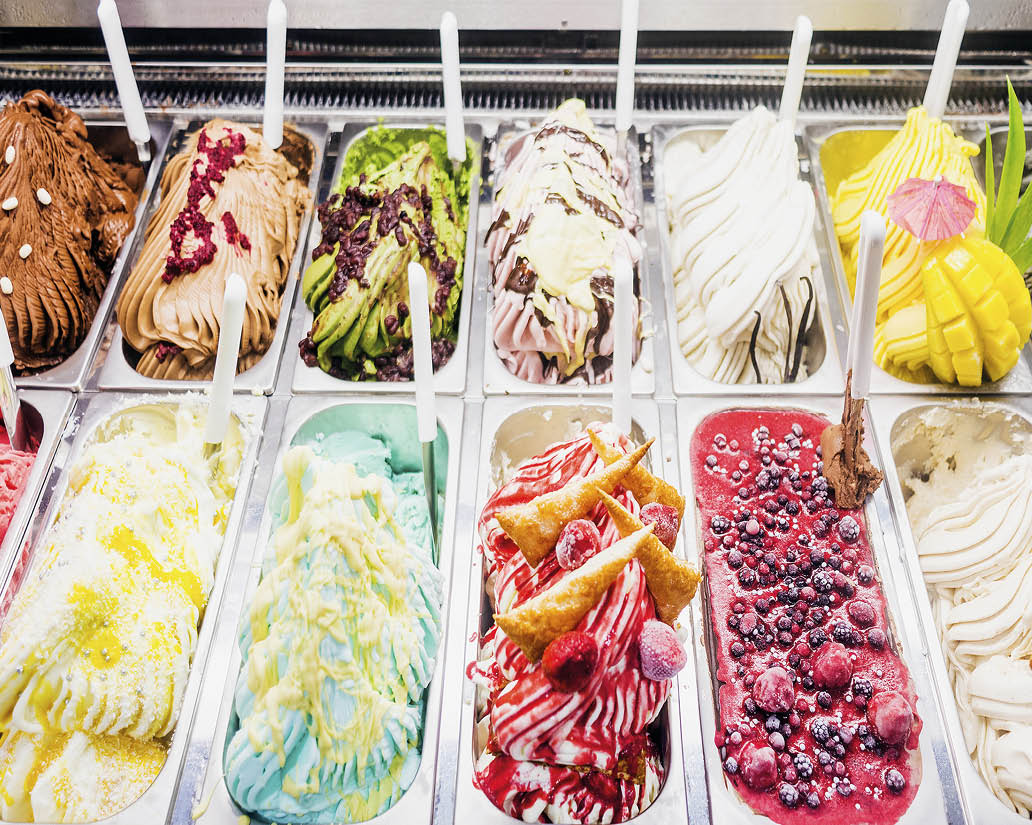 A display case filled with various flavors of ice cream. AI generated content