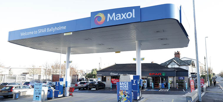 A gas station with a blue sign and a red car parked in front. AI generated content