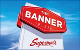 A white sign with red letters that says “The Banner Plaza". Description generated by AI