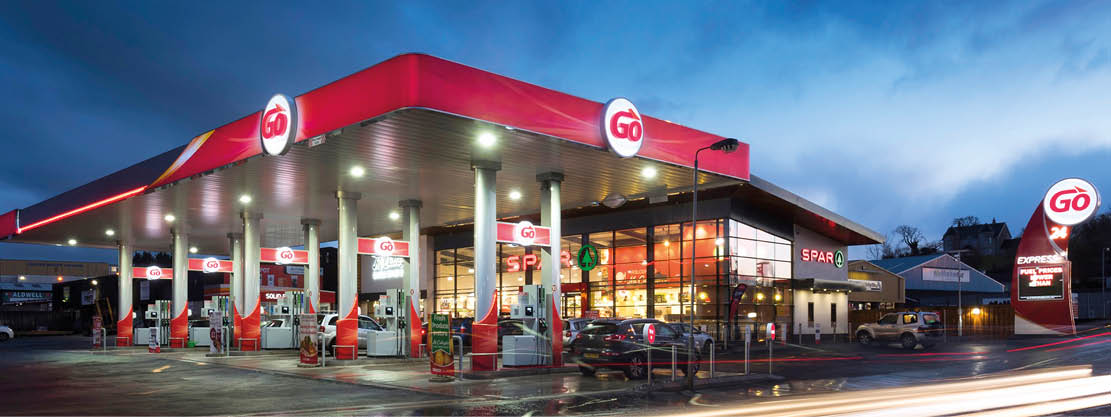 A gas station with a red roof and a sign that says “Gulf." AI generated content