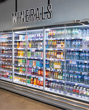 A refrigerator filled with various drinks. Description generated by AI