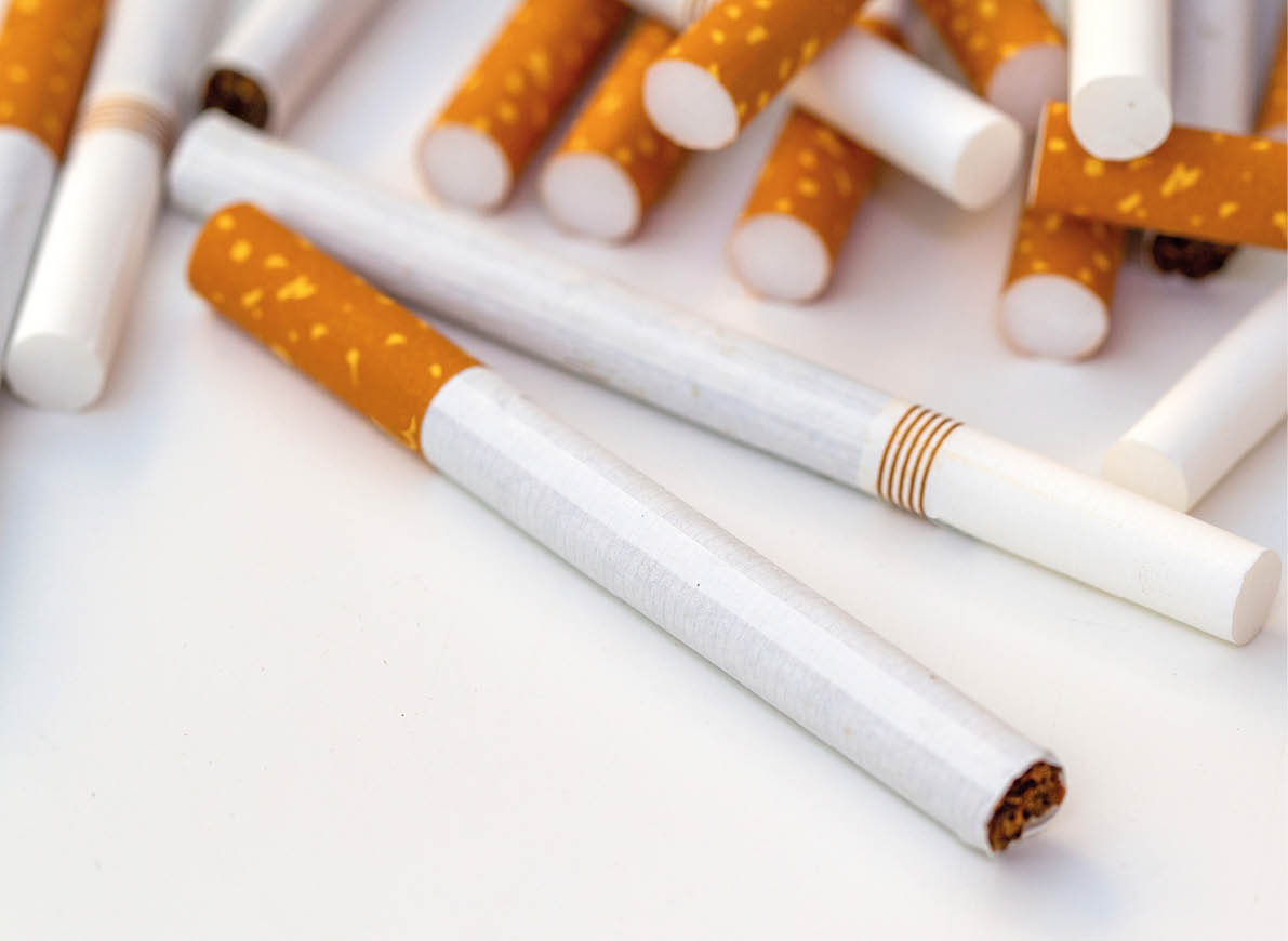Close up stack of cigarettes on white background. cigarettes isolated on white