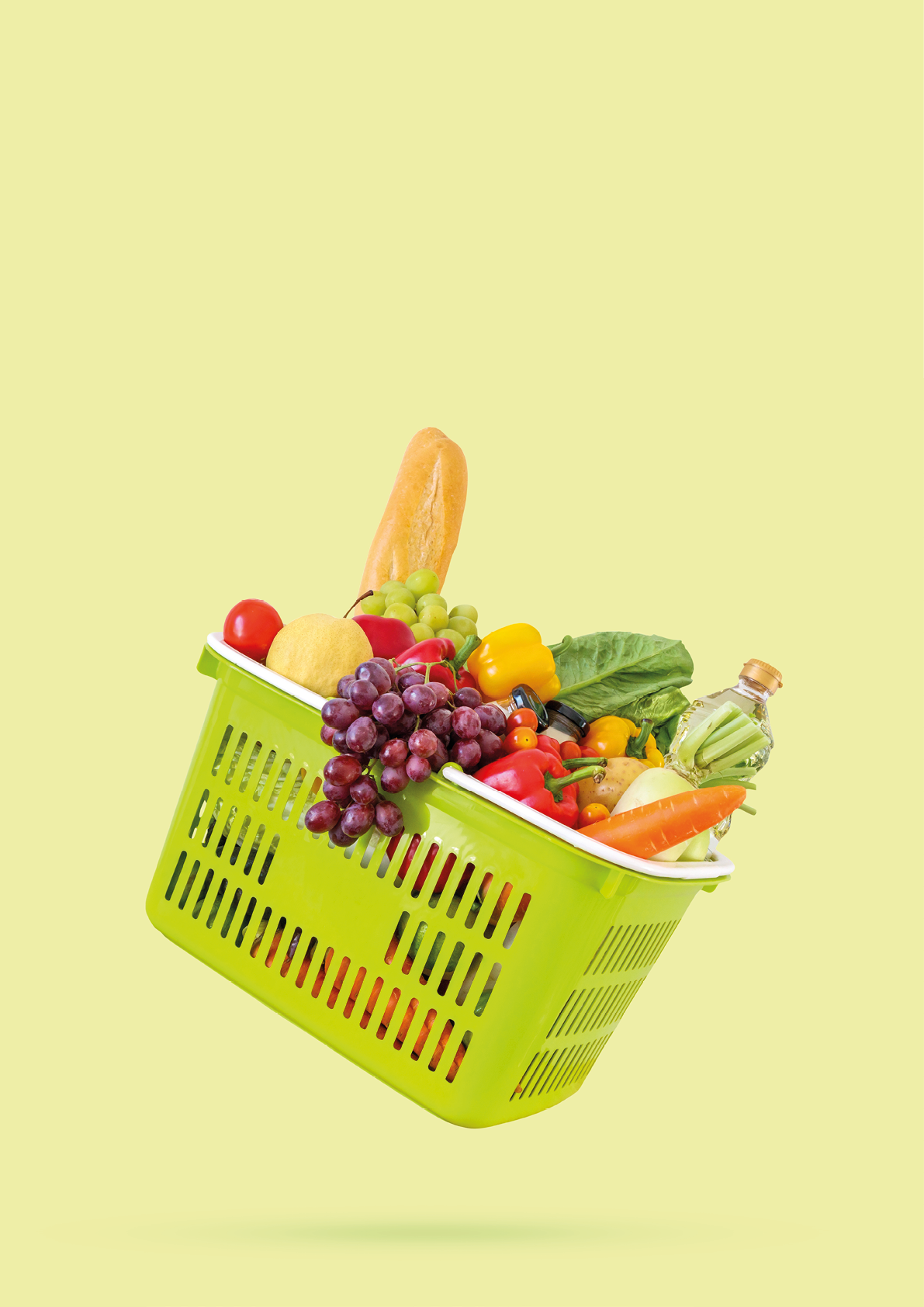 Fresh fruits and vegetables grocery product in green shopping basket isolated on green background