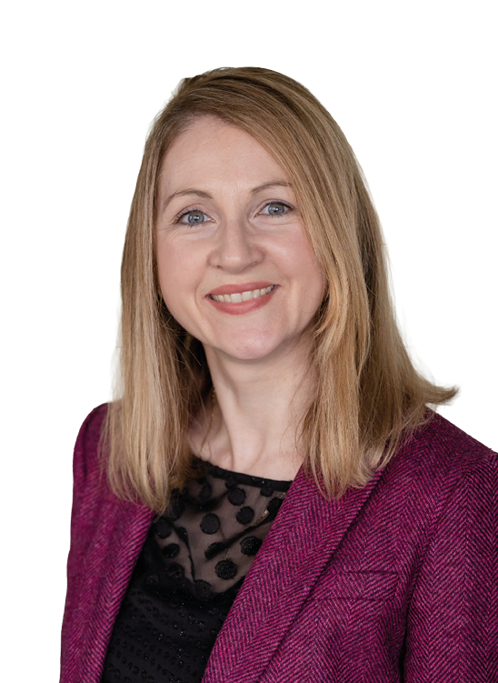 A woman wearing a purple jacket and black shirt. Description generated by AI