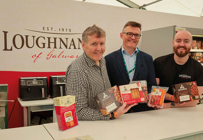 Three men holding boxes of food. Description generated by AI
