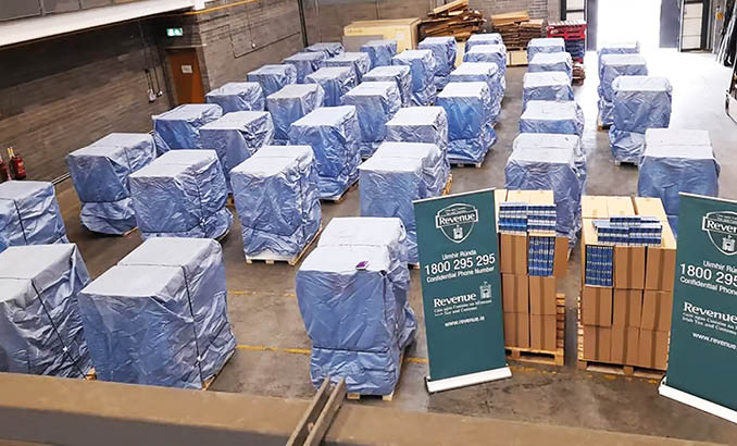 A large number of boxes are wrapped in plastic and stacked in a warehouse. Description generated by AI