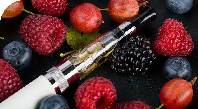 A pipe is on a table with a bunch of raspberries and blueberries. Description generated by AI