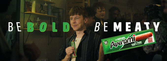 A man holding a green and white object. Description generated by AI