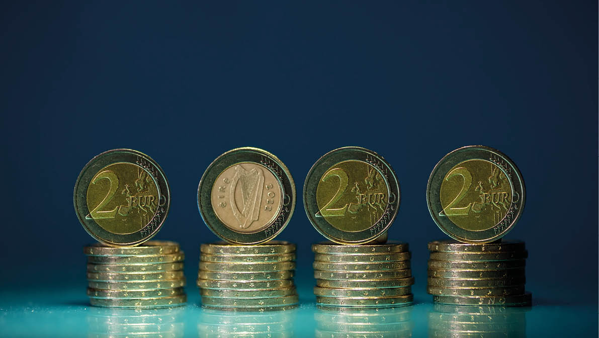 Sign 2022 year made out of European coins. Finance and banking background. Copy space. Irish coin with harp.