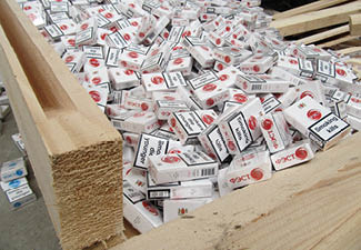 Krakovets, UKRAINE - MARCH, 2016: Smuggled cigarettes disguised as industrial wood were found by border guards in a truck heading through the “ Krakovets-Korchova" checkpoint from Ukraine to Poland