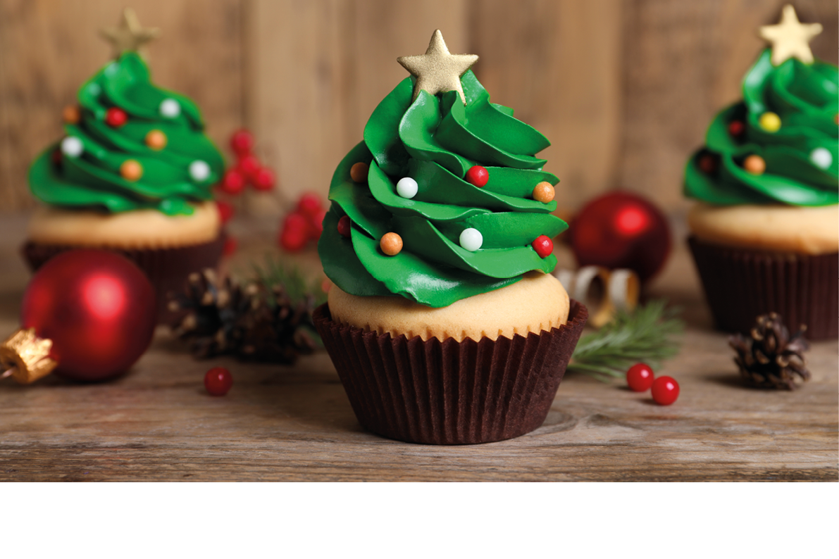 Christmas tree shaped cupcakes on wooden table