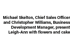 Michael Skelton, Chief Sales Officer and Christopher Williams, Business Development Manager, present Leigh Ann with f...