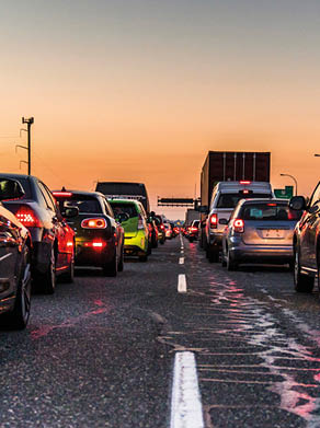 Vancouver, British Columbia - Canada. Traffic jam on a busy highway at rush hour. Cars in line, bumper to bumper, stuck in traffic at dusk on a clear sky night.