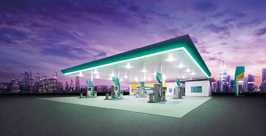Petrol gas station at night with city building 