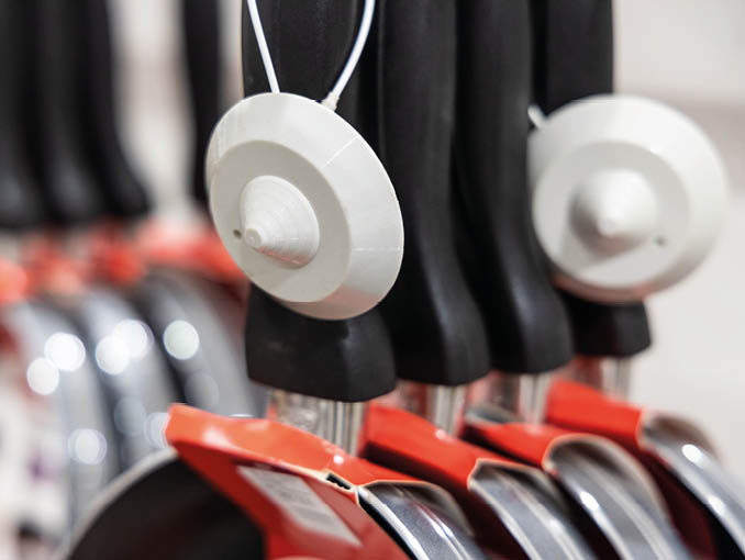 Closeup of retail theft prevention security tag on merchandise to deter theft