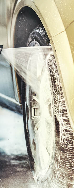 Washing car with soap. Close up concept.