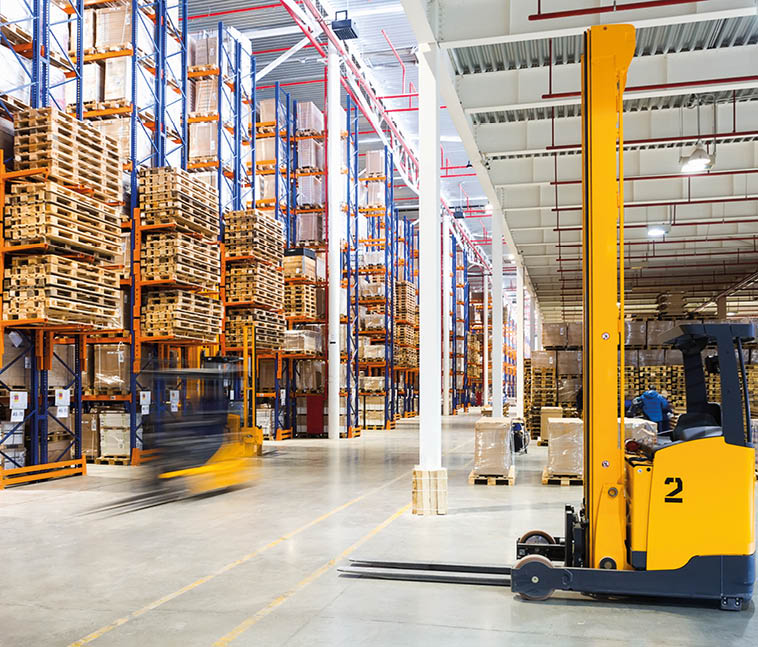 Large modern warehouse with forklifts