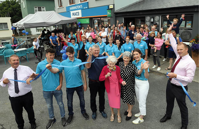 19-8-2022: 96 years old Mary Harrington, cuts the tape to officialy open the newly renovated Harrington's MACE Store in Ardgroom, West Cork on Friday surrounded by her family, daughter Noralene Harrington, son-in-law John Shea, grandchildren Micheal, Jack and Mary Kate Shea with Liam Attridge and Colin Brady from MACE. Photo: Don MacMonagle repro free photo from MACE