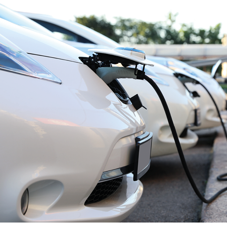 Charging modern electric cars from station outdoors