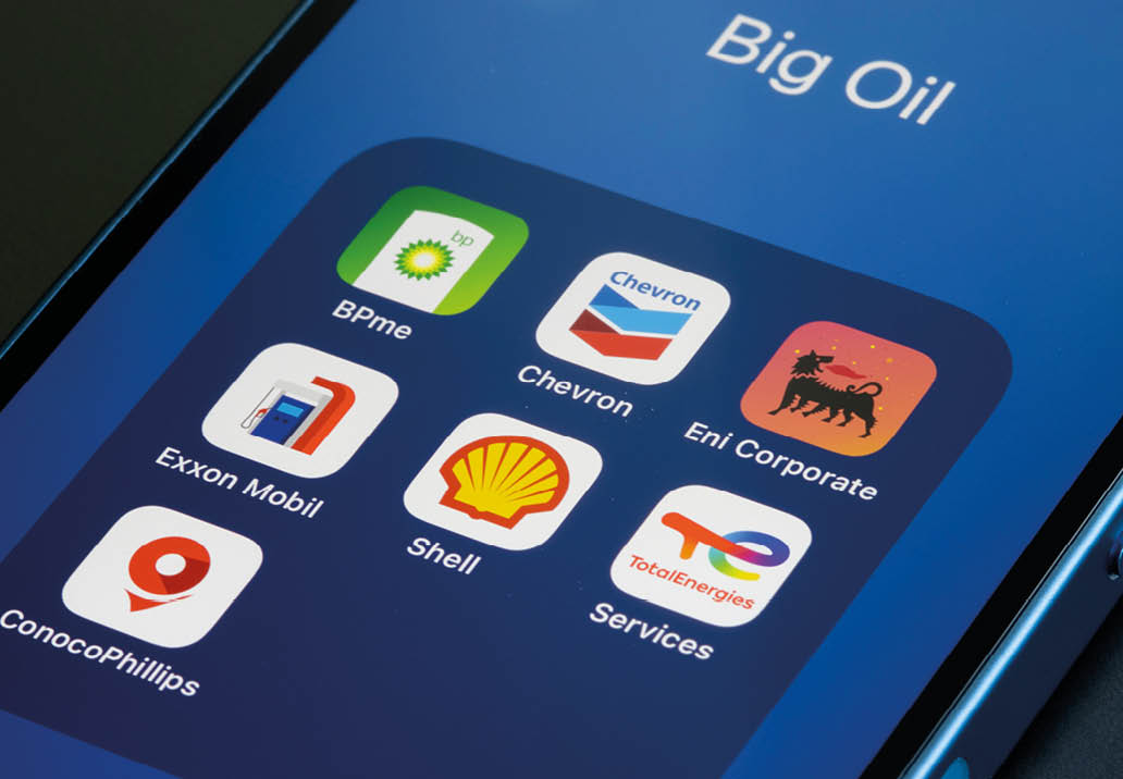 Portland, OR, USA - Jan 20, 2022: App icons representing Big Oil (supermajors) - BP, Chevron, Eni, ExxonMobil, Royal Dutch Shell, TotalEnergies, and ConocoPhillips - are seen on an iPhone.
