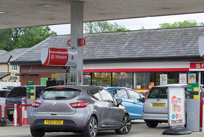 Clitheroe, Lancashire/UK - June 18th 2019: Texaco petrol station with Spar shop and cars at petrol pumps on forecourt