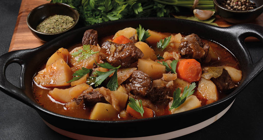 Irish stew made with beef, potatoes, carrots and herbs. Traditional St.Patrick's day dish, stewed in dark Guinness beer