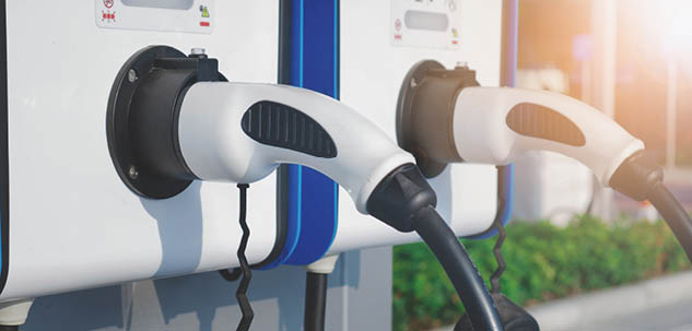electric vehicle charging (Ev) station with plug of power cable supply for Ev car. Smart enegy.Flare light effect