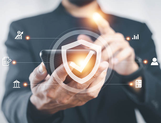 Businessman using mobile smartphone to buy insurance online for car, travel, family and life, financial and health insurance. Insurance concept.