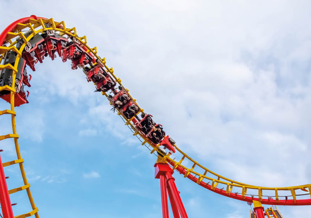 A roller coaster in action at an amusement park