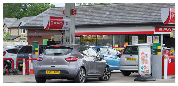 Clitheroe, Lancashire/UK - June 18th 2019: Texaco petrol station with Spar shop and cars at petrol pumps on forecourt