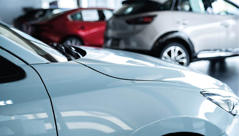 Car parked in luxury showroom. Car dealership office. Car showroom business. New car parked in modern showroom. Auto for sale and rent business. Automobile leasing and insurance. Electric automobile.