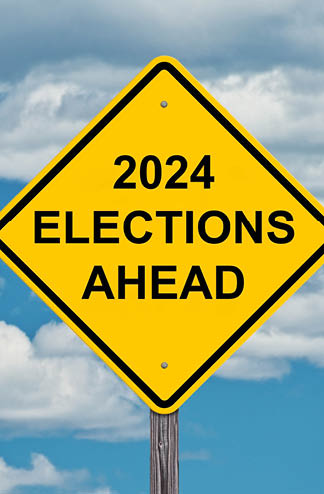 2024 Elections Ahead Caution Sign with Blue Sky Background