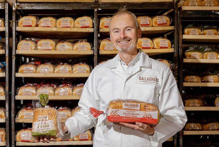 Repro Free by James Connolly: Gallagher s Bakery CEO, Patrick O Sullivan, checks out the first batch of the new Gallagher s Bakehouse range before it is dispatched  Gallagher s is looking to shake-up the packaged bread sector industry with the launch of an innovative range of everyday handcrafted sourdough bread products  The 52-year-old business is changing its brand positioning and offering in line with consumer demand for tastier, more nutritious products which contribute to a healthier lifestyle  The new products deliver on health benefits   such as being a good source of high in fibre which is good for gut health  with one of the products high in Vitamin D3  which is important for building and keeping strong bones  Sourdough is generally rich in prebiotics, which complement good gut health and enhance the body s ability to absorb vitamins and minerals 